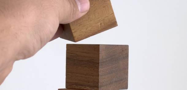 Stacking wooden blocks.