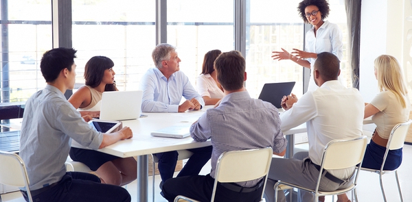 Conference room filled with employees.