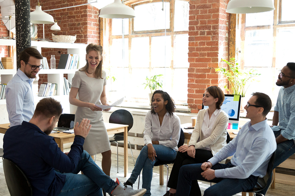 Group of colleagues meeting in a circle.