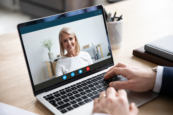 Virtual meeting using a laptop.